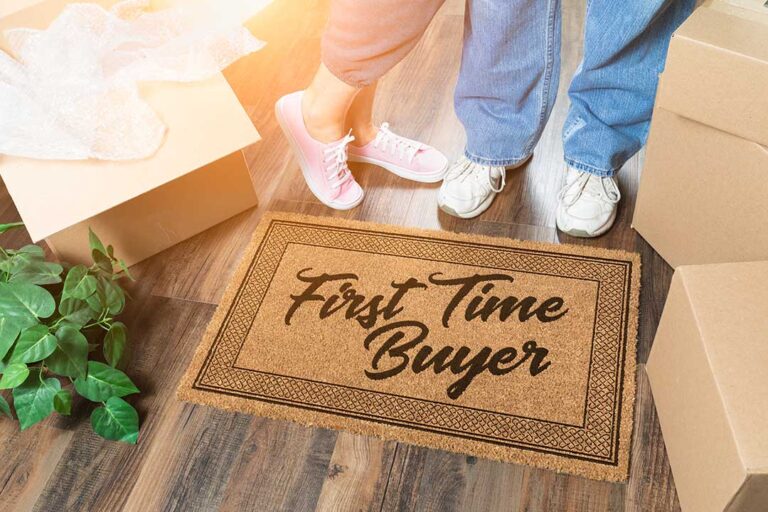 A family labels packed boxes in a bright living room beside a written moving calendar.